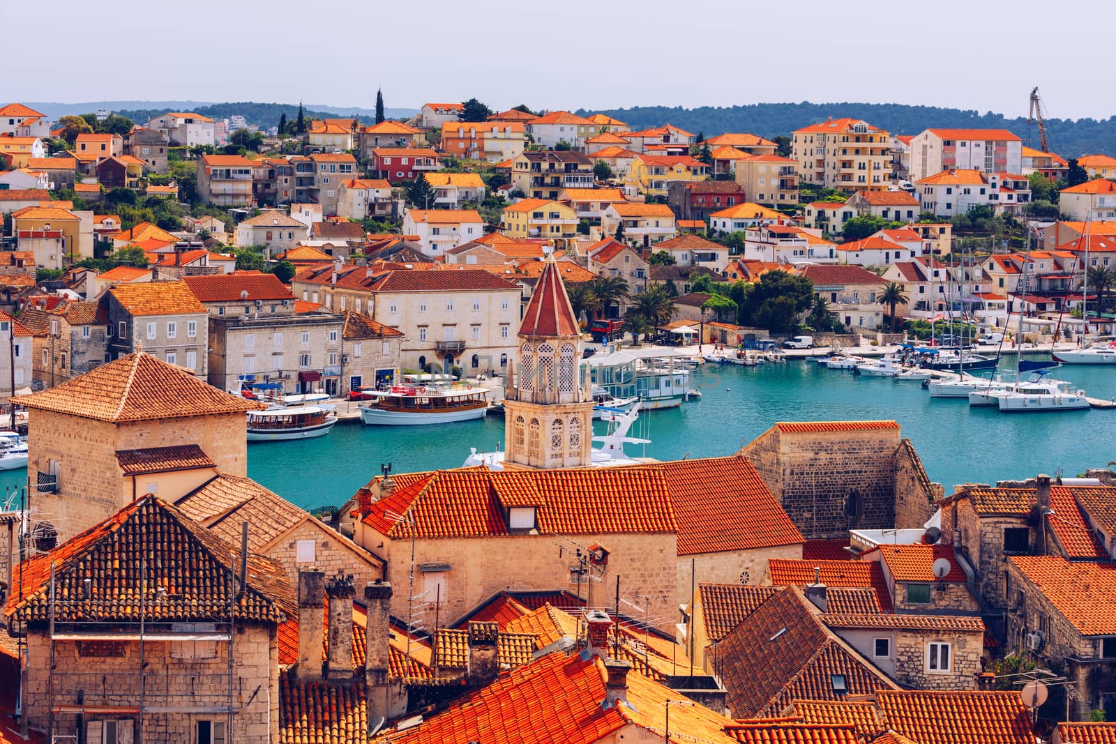 Trogir in Croatia, town panoramic view with red roof tiles, Croatian tourist destination. Trogir town sea front view, Croatia. Roofs of Trogir in Croatia.
