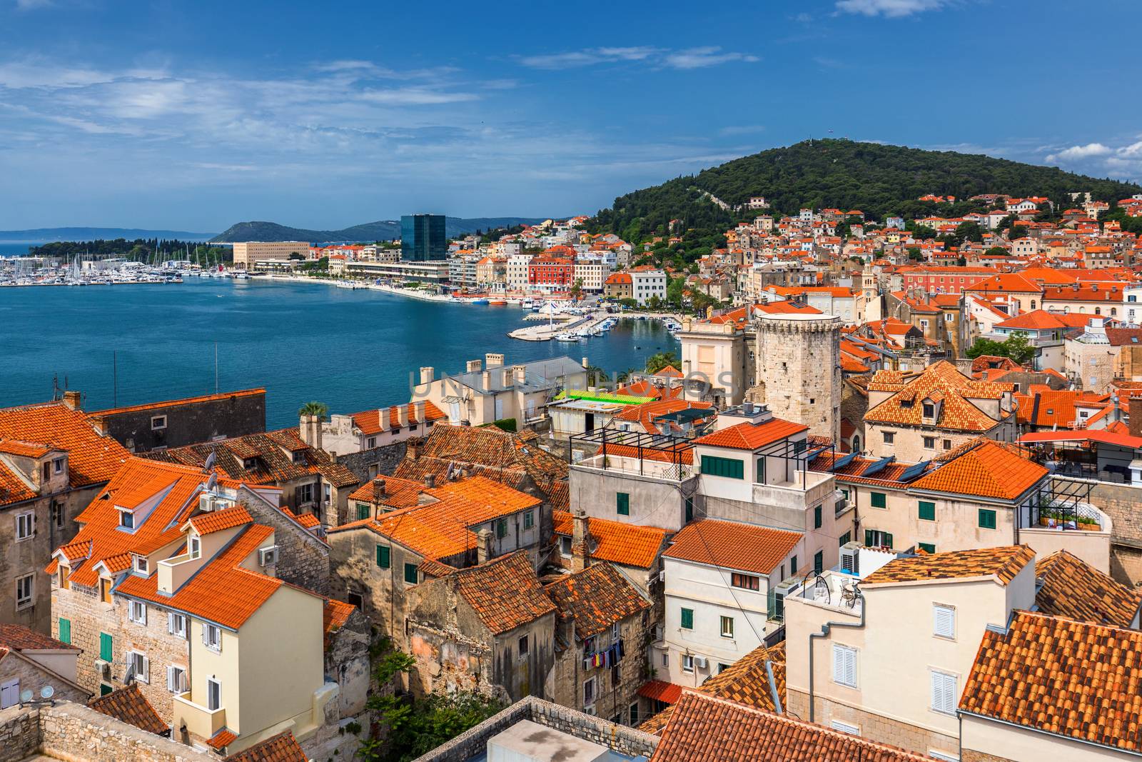 Split waterfront and Marjan hill aerial view, Dalmatia, Croatia. Panoramic summer cityscape of old medieval city Split, Croatia, Europe.  Traveling concept background. 