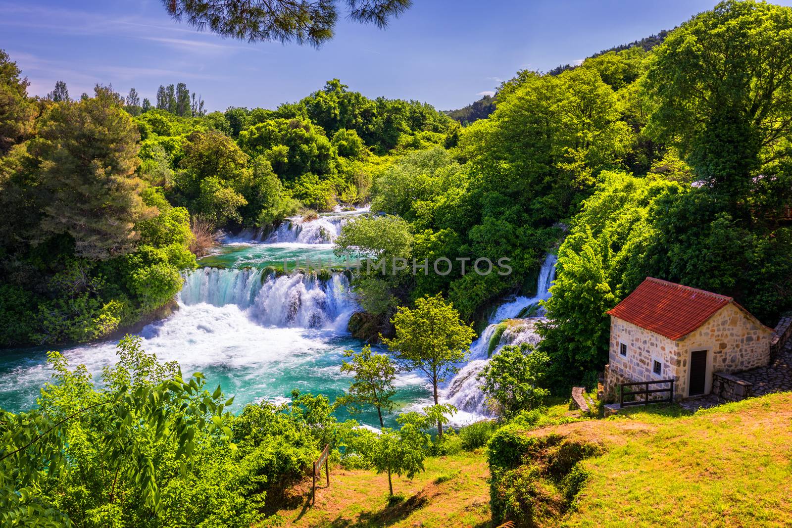 Waterfalls Krka, National Park, Dalmatia, Croatia. View of Krka National Park, Roski Slap location, Croatia, Europe. Beautiful world of Mediterranean countries. Traveling concept background.