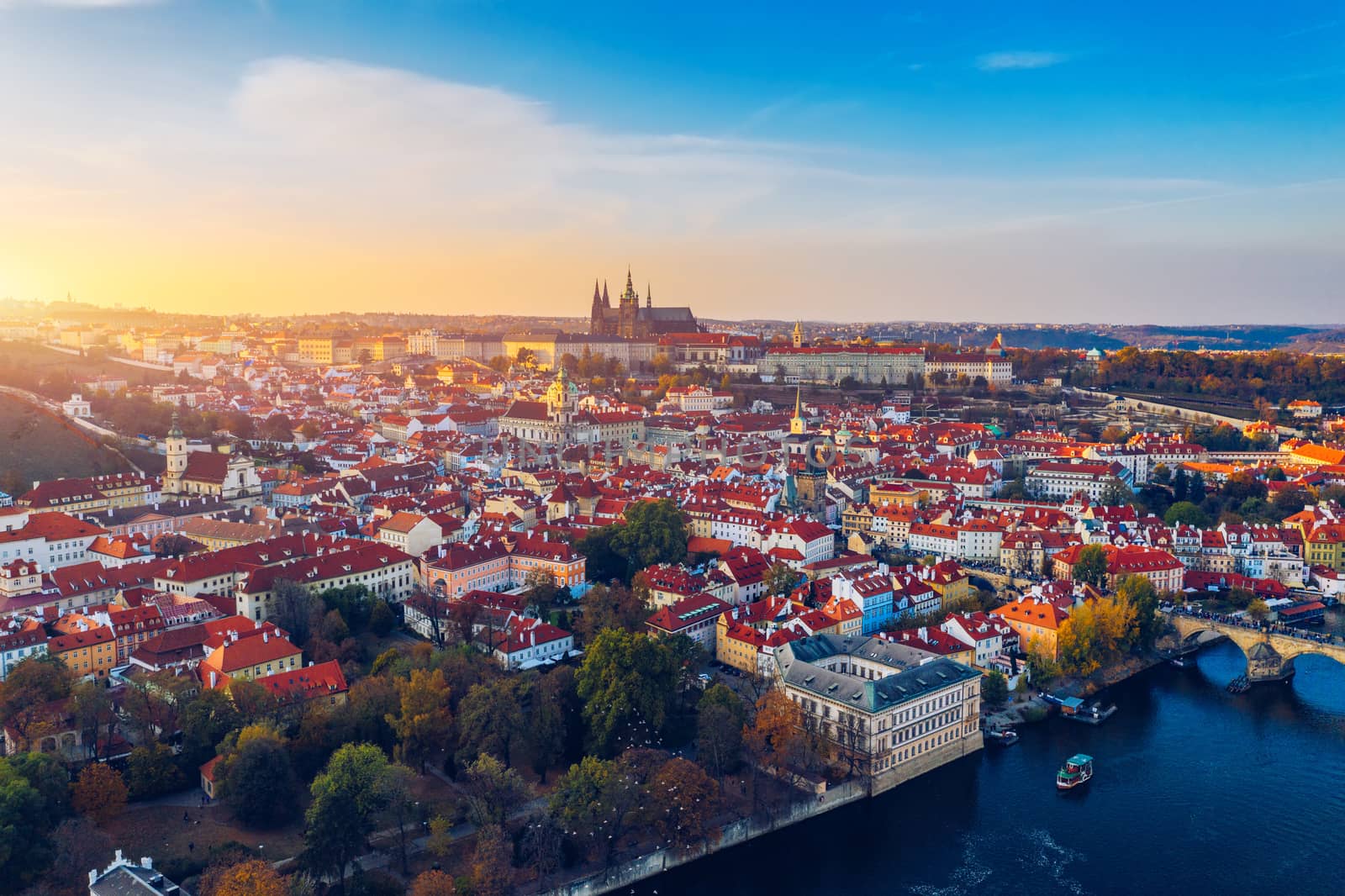 Aerial Prague panoramic drone view of the city of Prague at the Old Town Square, Czechia. Prague Old Town pier architecture and Charles Bridge over Vltava river in Prague at sunset, Czech Republic. 