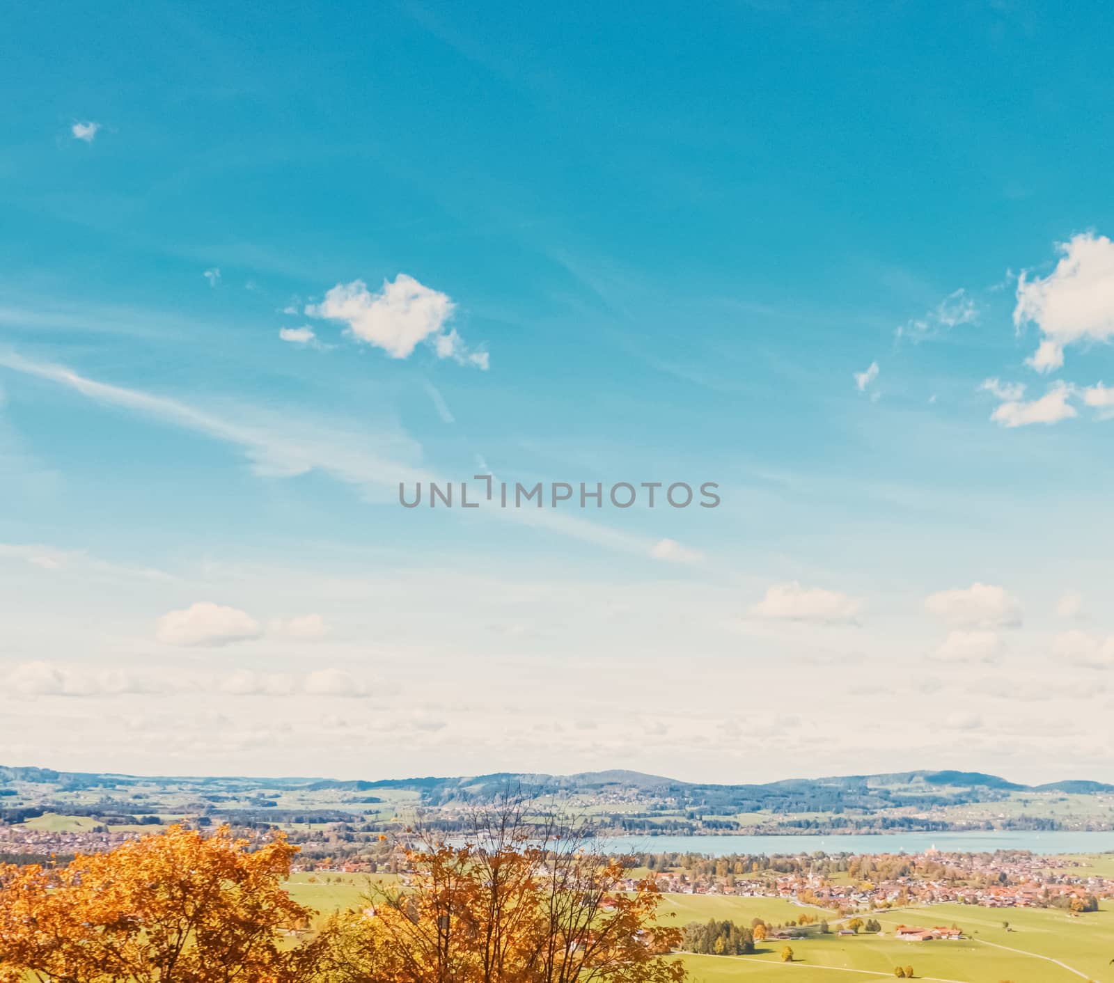 Beautiful nature of European Alps, landscape view of alpine mountains, lake and village in autumn season, travel and destination scenery