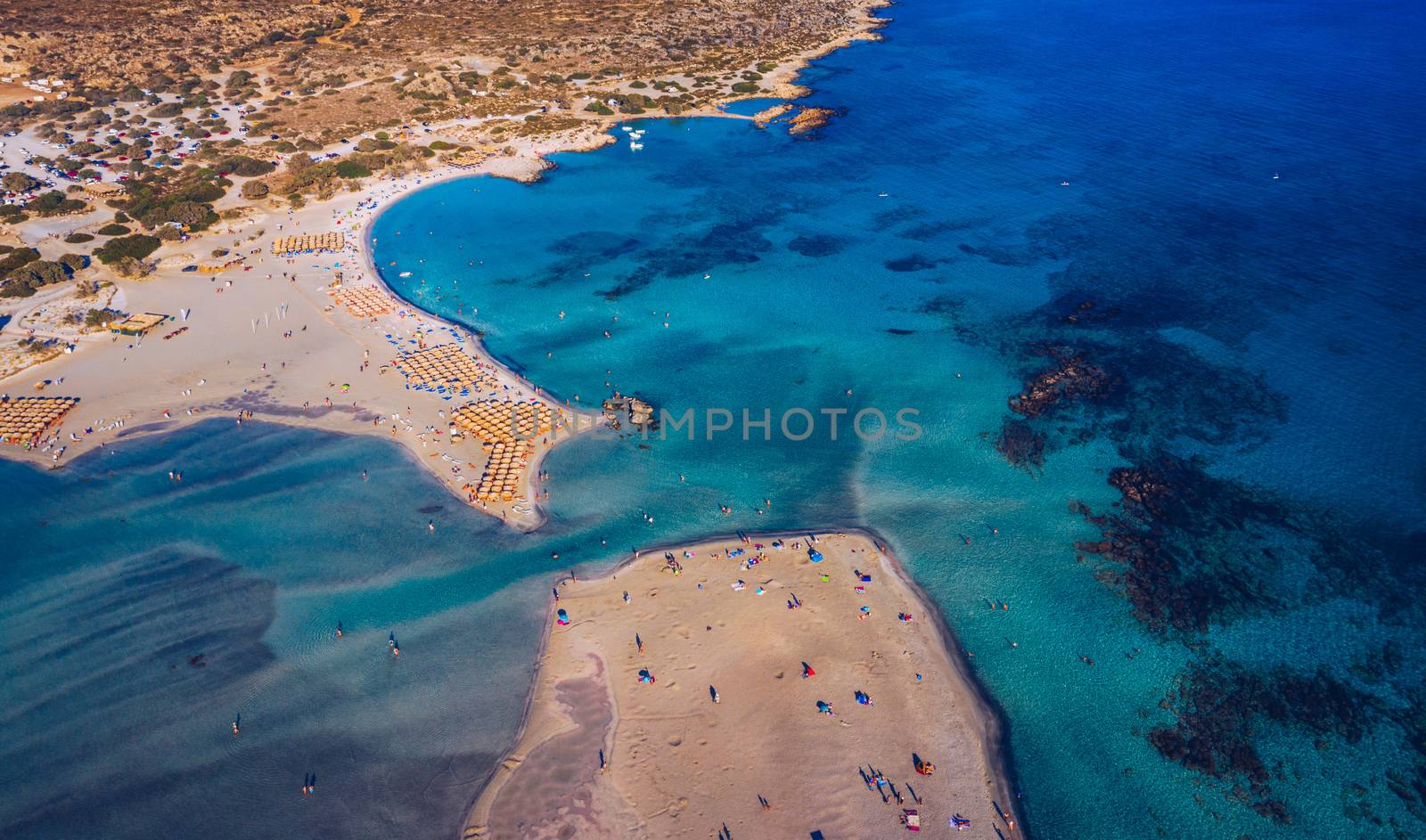 Aerial view of beautiful tropical Elafonissi Beach with pink sand. View of a nice tropical Elafonissi beach from the air. Beautiful sky, sea, resort. Elafonissi beach, Crete, Greece.