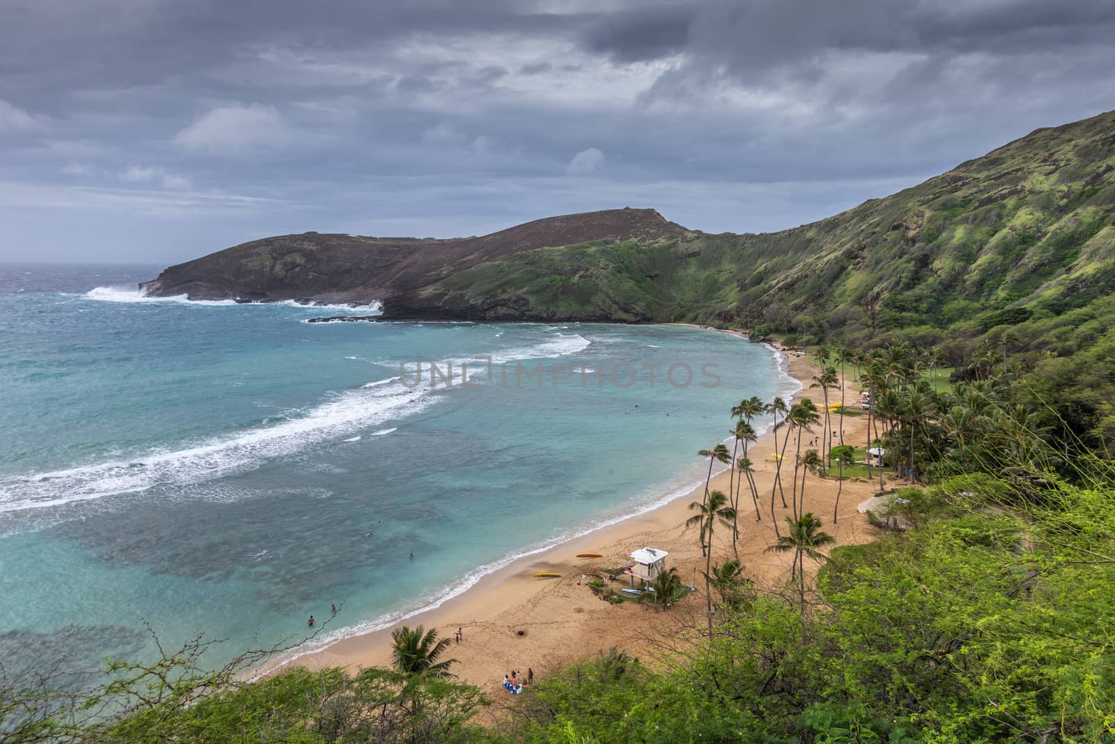 Overview of Beach of Hanauma Bay under storm clouds,  Oahu, Hawa by Claudine