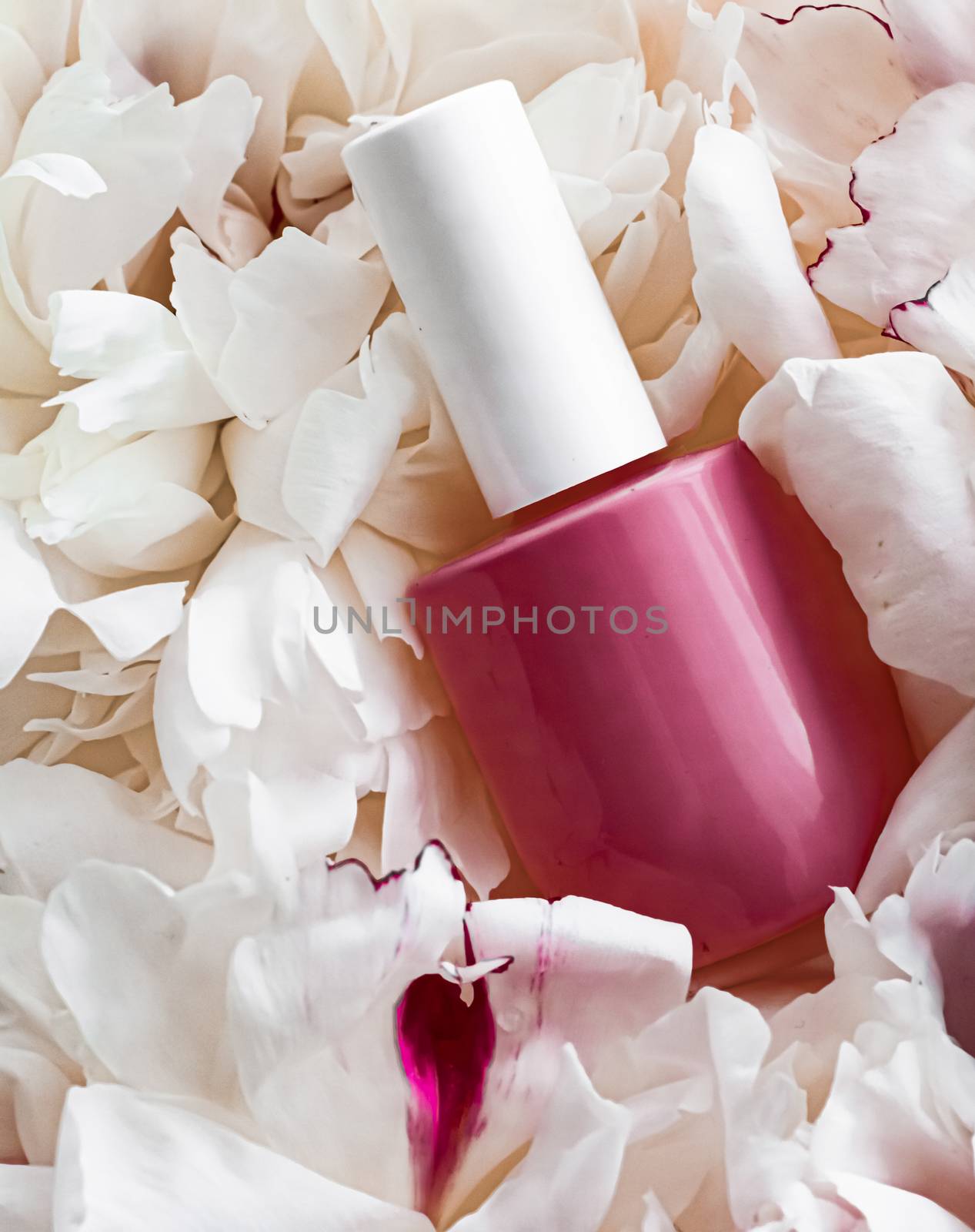 Nail polish bottles on floral background, french manicure and cosmetic branding design