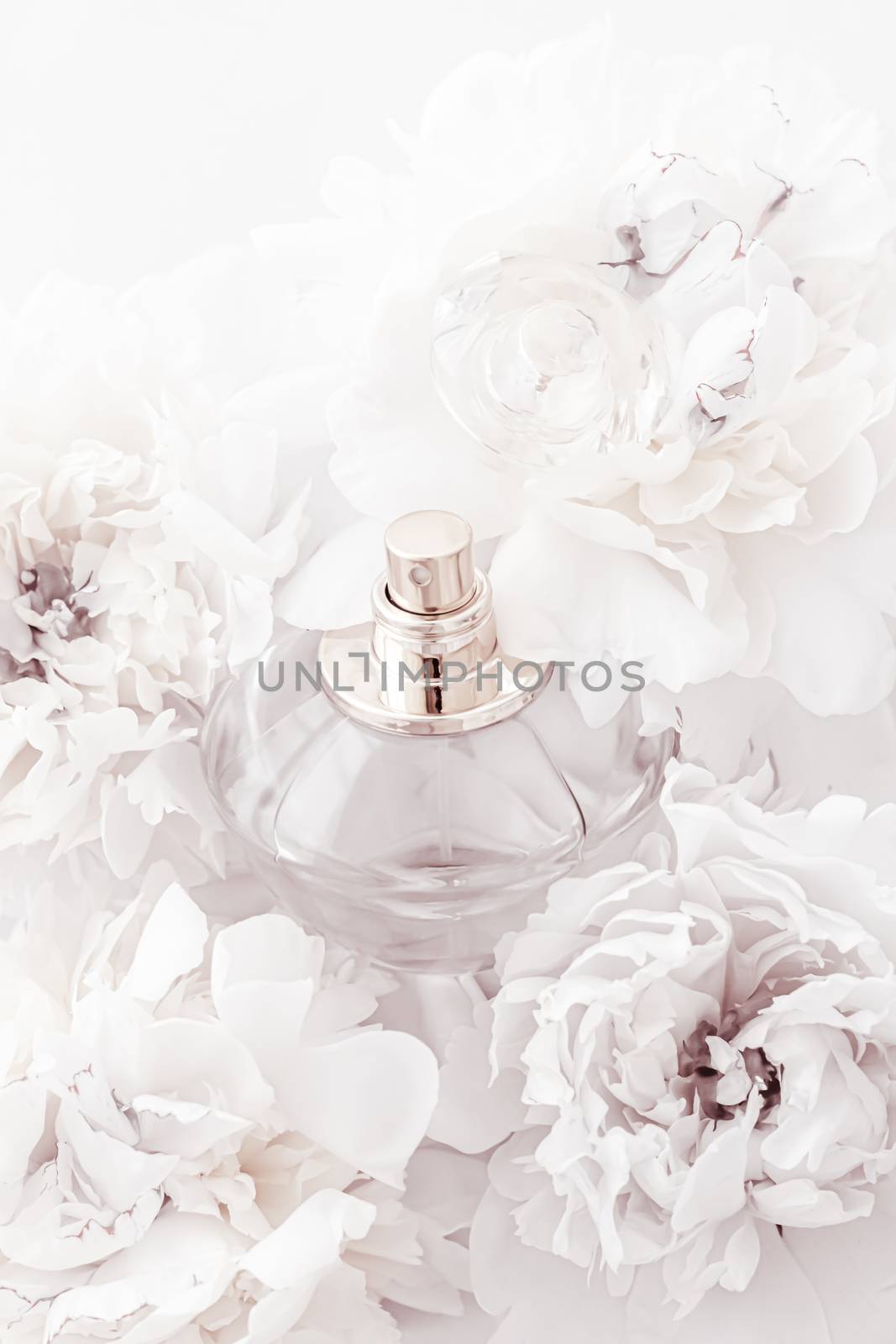 Chic fragrance bottle as luxe perfume product on background of peony flowers, parfum ad and beauty branding by Anneleven