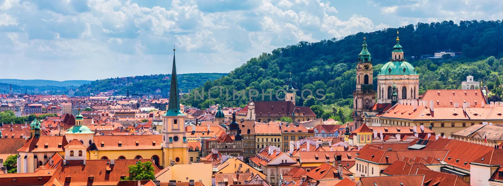 Top view to red roofs skyline of Prague city, Czech Republic. Aerial view of Prague city with terracotta roof tiles, Prague, Czechia. Old Town architecture with terracotta roofs in Prague.