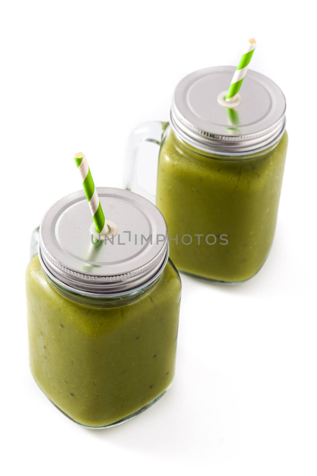 Healthy green smoothie with spinach,mint, kiwi, ginger and green apple isolated on white background