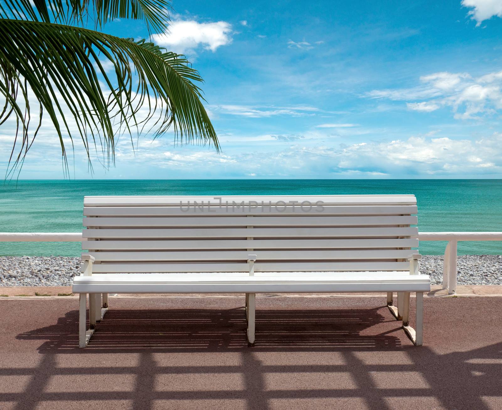 Empty bench overlooking the sea. Promenade des Anglais, Nice, France.