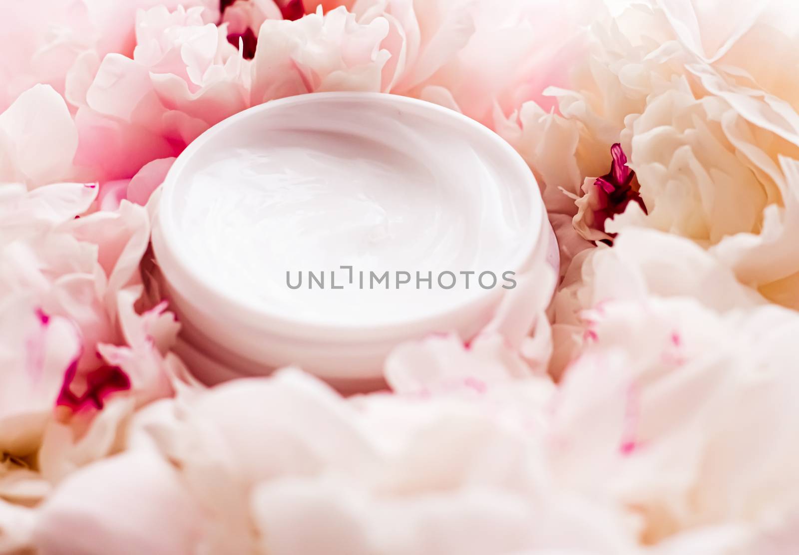 Luxe cosmetic cream jar as antiaging skincare routine product on background of peony flowers, body moisturizer and beauty branding design