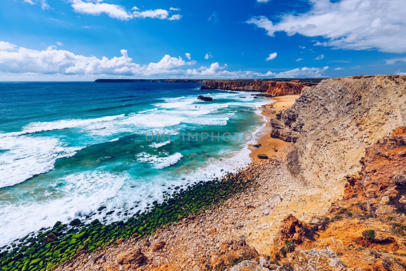 Panorama view of Praia do Tonel (Tonel beach) in Cape Sagres, Algarve, Portugal. Praia Do Tonel, beach located in Alentejo, Portugal. Ocean waves on Praia Do Tonel beach. View from Sagres fortress.