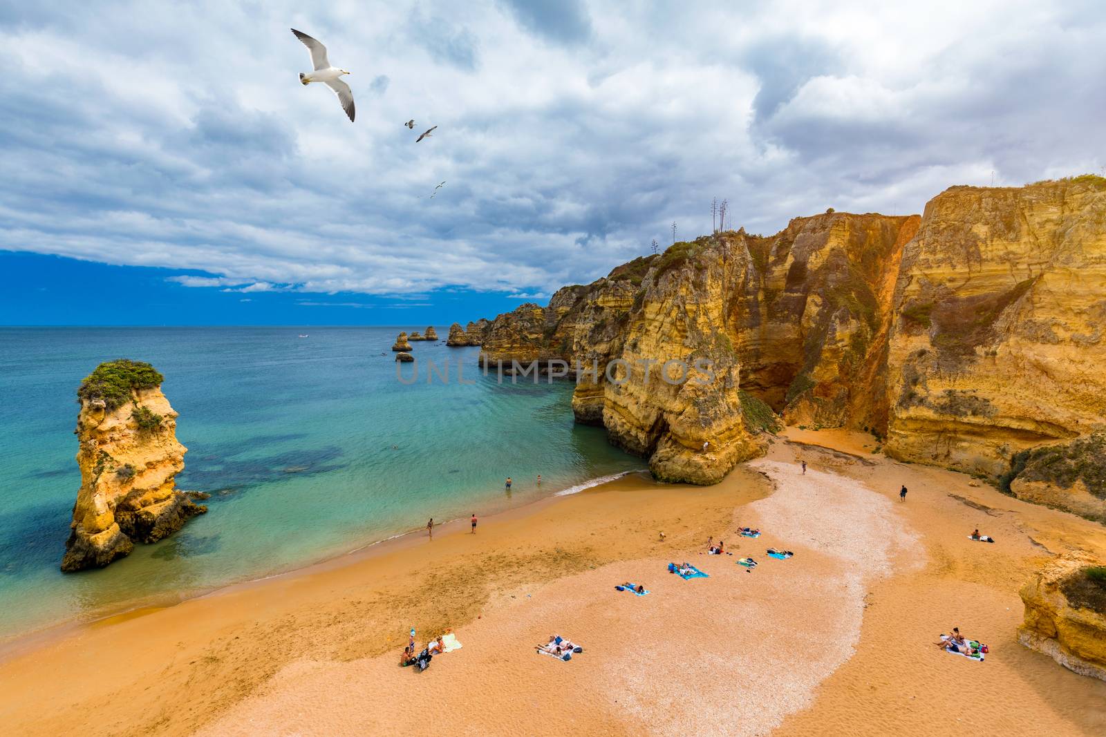 Praia Dona Ana beach with turquoise sea water and cliffs, Portugal. Beautiful Dona Ana Beach (Praia Dona Ana) in Lagos, Algarve, Portugal.