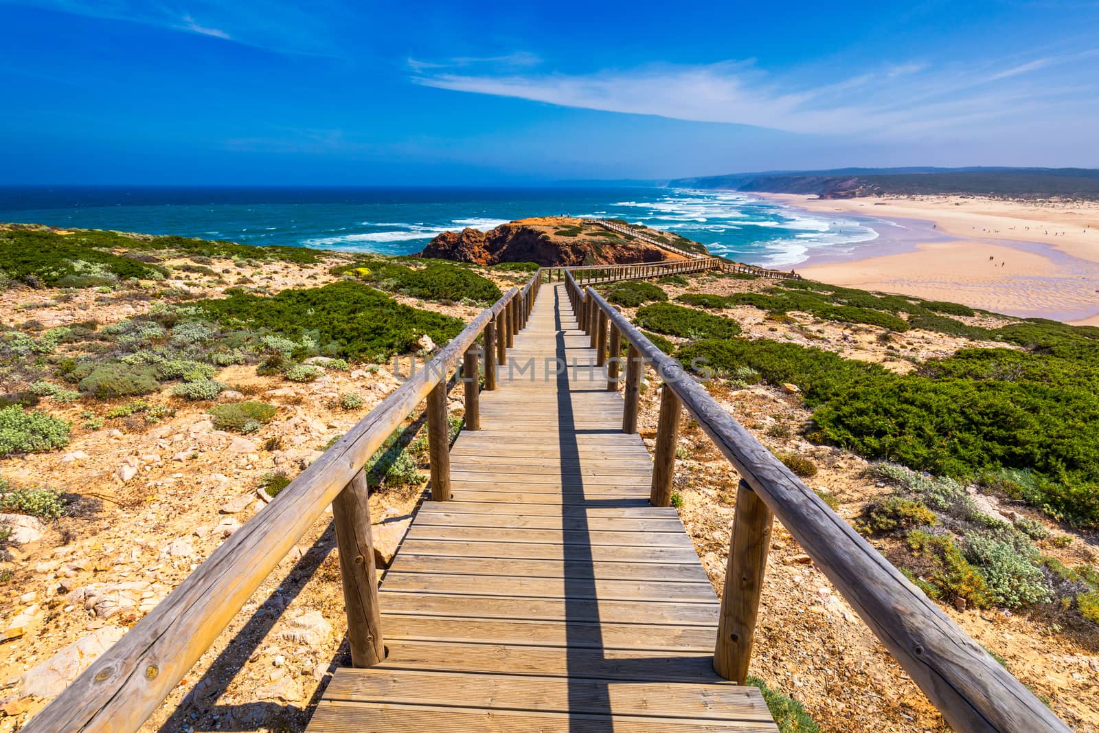 Praia da Bordeira and boardwalks forming part of the trail of tides or Pontal da Carrapateira walk in Portugal. Amazing view of the Praia da Bordeira in portuguese. Bordeira, Algarve, Portugal.