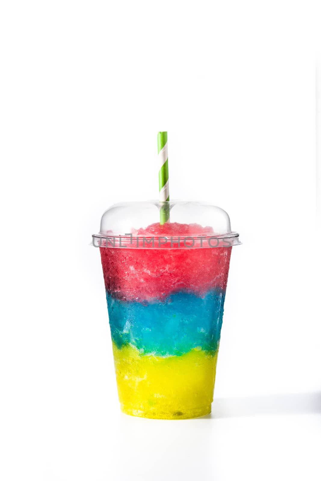 Colorful slushie with straw in plastic cup isolated on white background