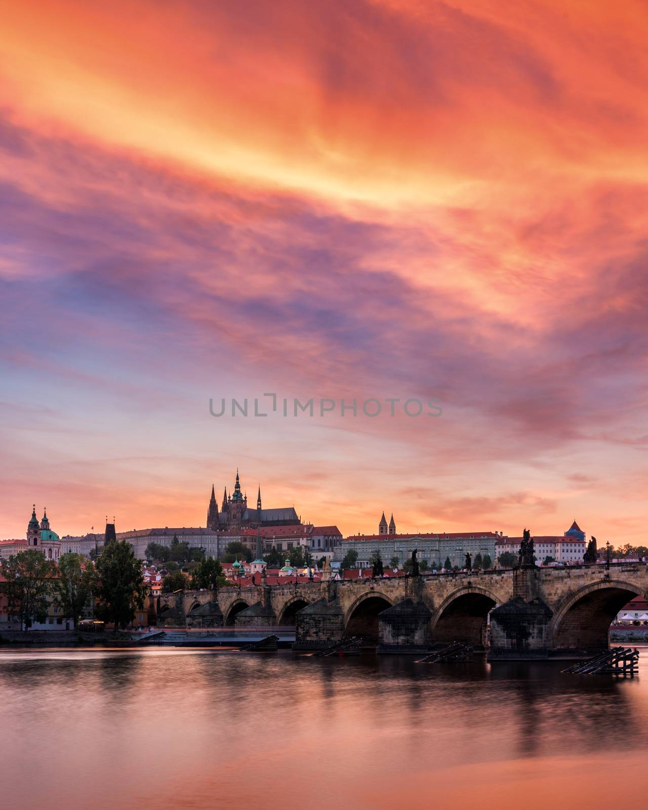 Charles Bridge at sunset with colorful sky, Prague, Czech Republic. Prague old town and iconic Charles bridge and Castle, Czech Republic. Charles Bridge (Karluv Most), Old Town Tower and Castle.