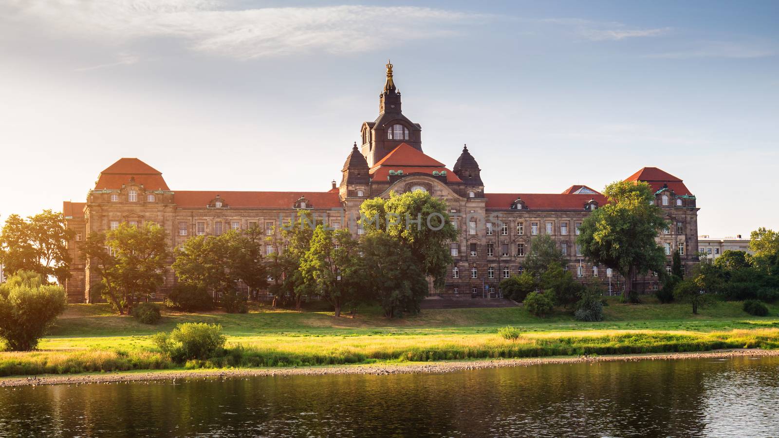 Incredible evening panorama of Cathedral of the Holy Trinity or Hofkirche, Bruehl's Terrace or The Balcony of Europe. Dramatic autumn sunset on Elbe river in Dresden, Saxony, Germany, Europe.