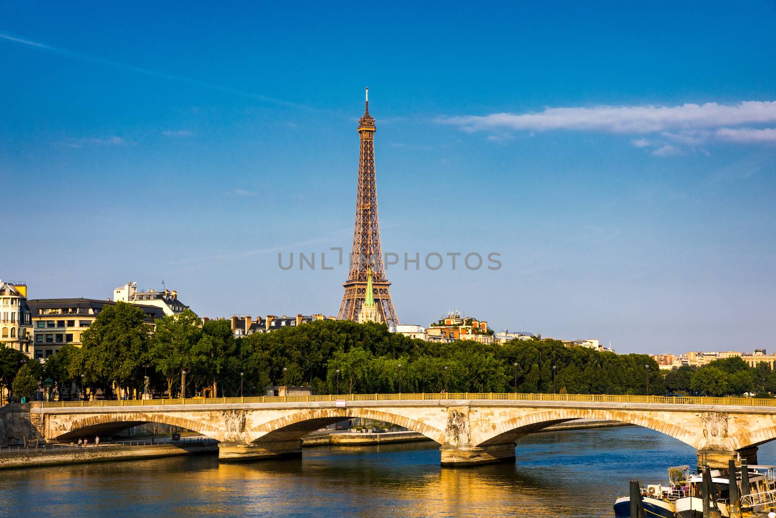 Paris Eiffel Tower and river Seine at sunset in Paris, France. Eiffel Tower is one of the most iconic landmarks of Paris. Eiffel tower in summer, Paris, France. The Eiffel Tower in Paris, France.
