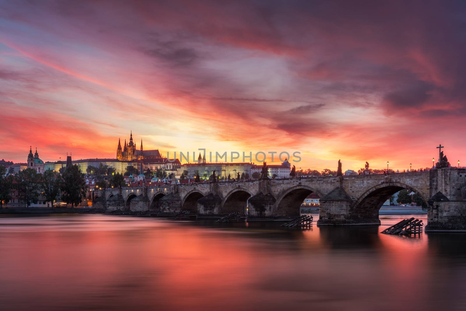 Charles Bridge at sunset with colorful sky, Prague, Czech Republic. Prague old town and iconic Charles bridge and Castle, Czech Republic. Charles Bridge (Karluv Most), Old Town Tower and Castle.