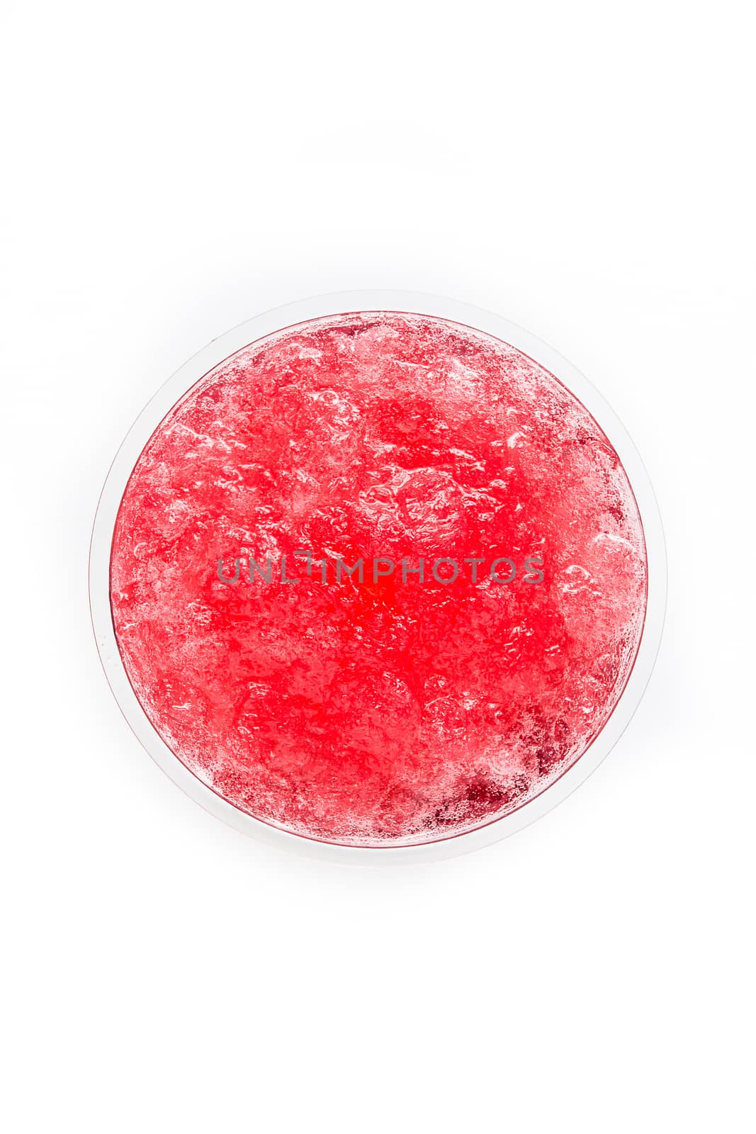Red slushie in plastic cup isolated on white background