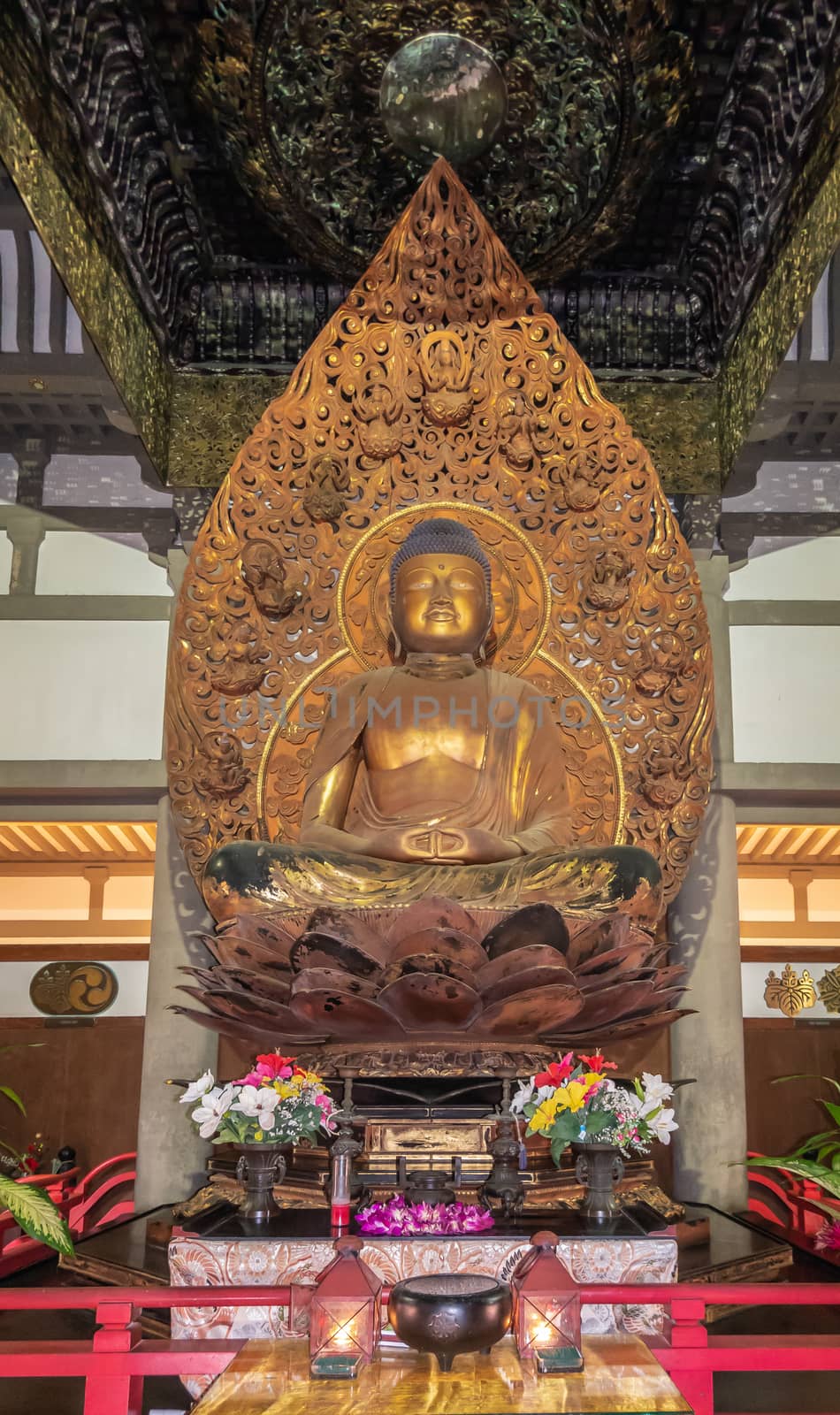 Golden Bhudda in Byodo-in Buddhist temple in Kaneohe, Oahu, Hawa by Claudine