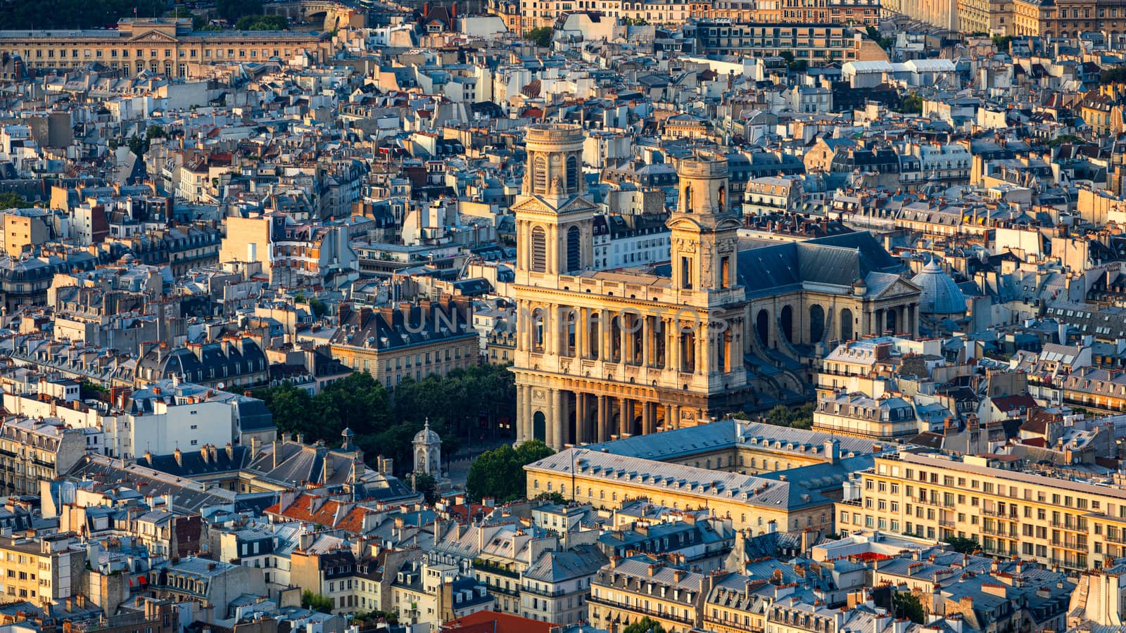 Saint Sulpice Church highlighted by the sun. Built in 1754 Eglise Saint-Sulpice is one of the biggest churches in Paris. Saint-Germain-des-Pres district, Place Saint-Sulpice, Paris, France