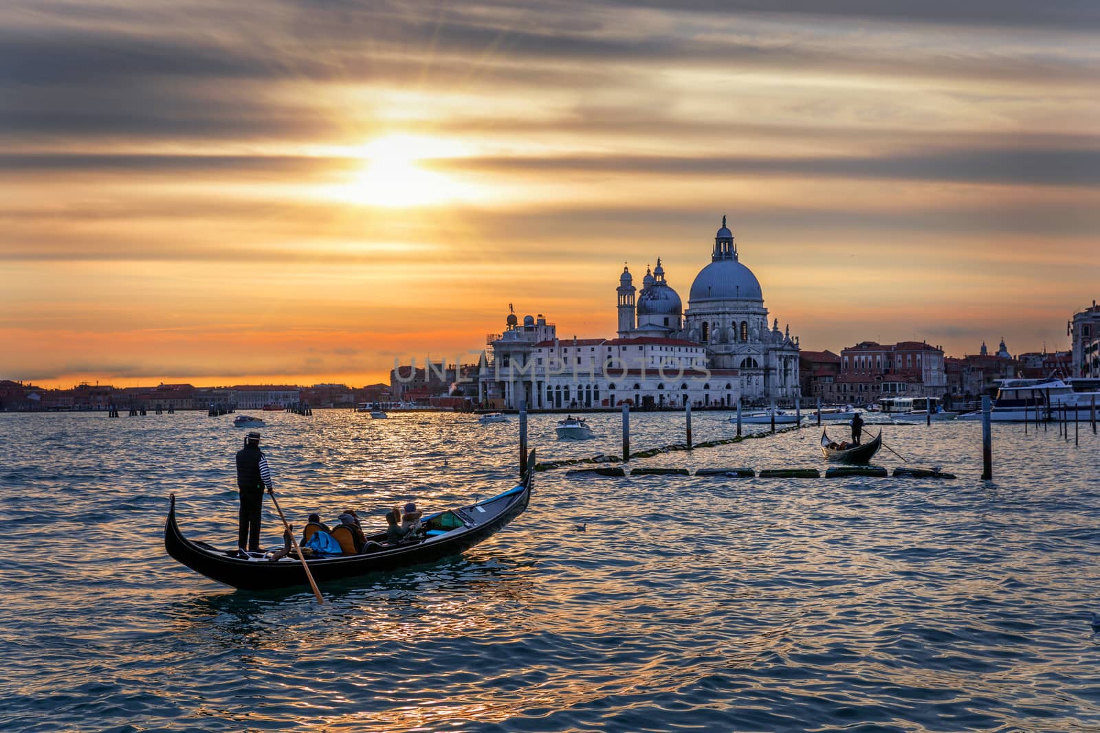 Canal with gondolas in Venice, Italy. Architecture and landmarks of Venice. Venice postcard with Venice gondolas.