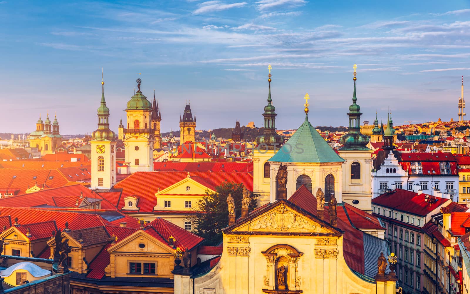 Scenic summer aerial panorama of the Old Town architecture in Prague, Czech Republic. Red roof tiles panorama of Prague old town.  Prague Old Town Square houses with traditional red roofs. Czechia.