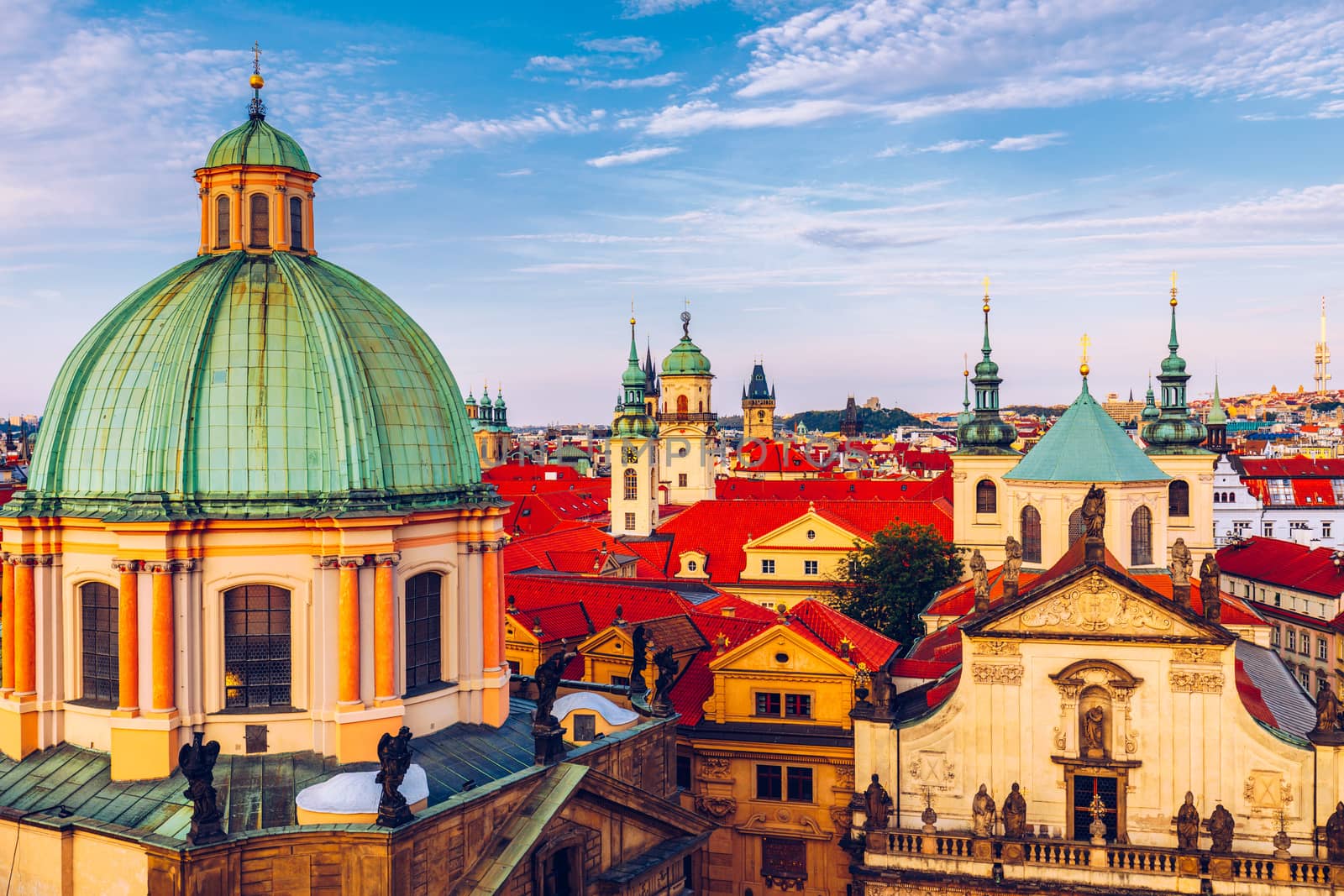 Scenic summer aerial panorama of the Old Town architecture in Prague, Czech Republic. Red roof tiles panorama of Prague old town.  Prague Old Town Square houses with traditional red roofs. Czechia.