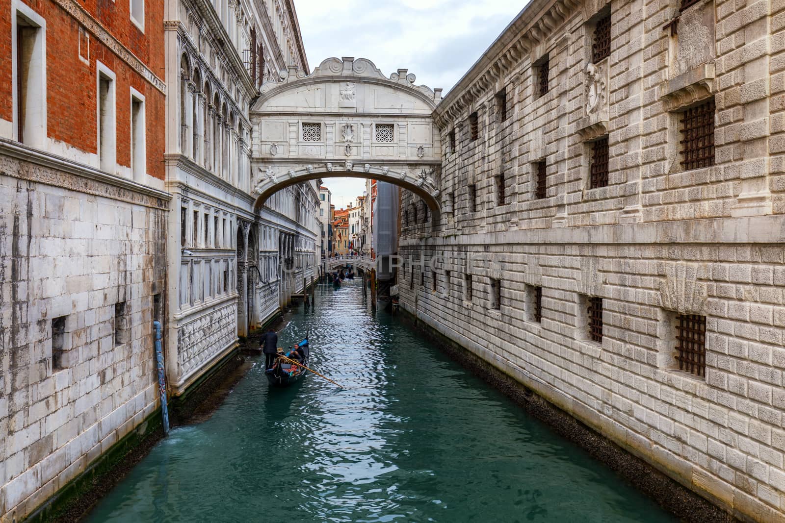 Canal with gondolas in Venice, Italy. Architecture and landmarks by DaLiu