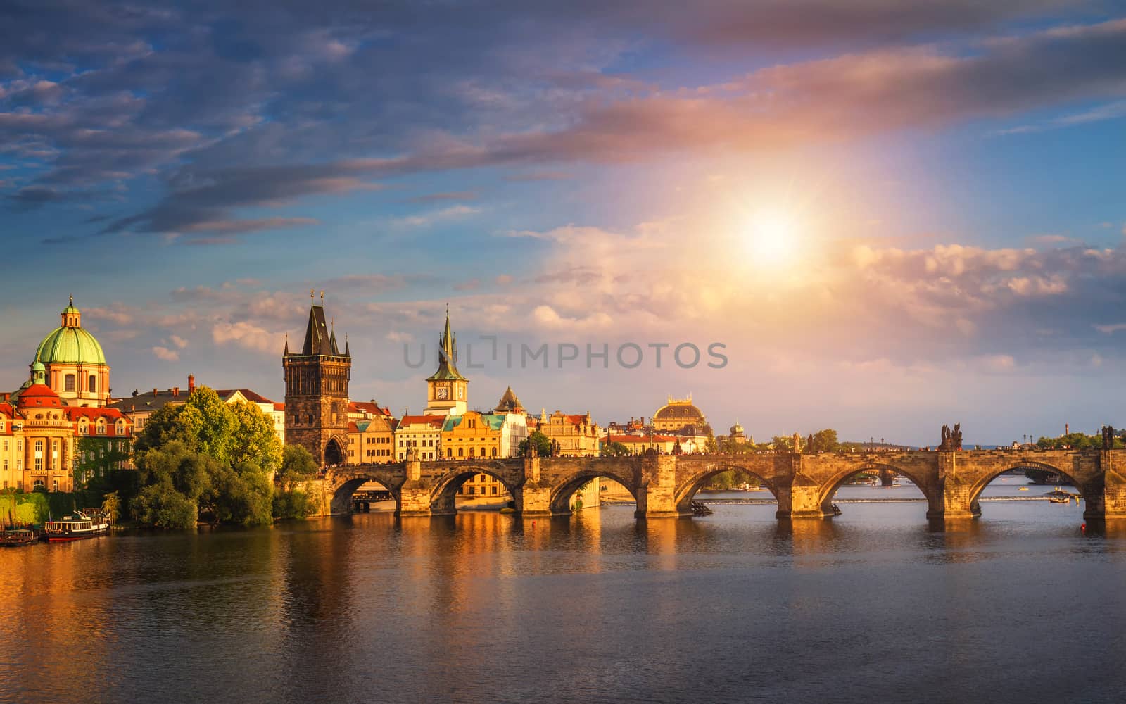 Prague, Czech Republic panorama with historic Charles Bridge and Vltava river on sunny day.