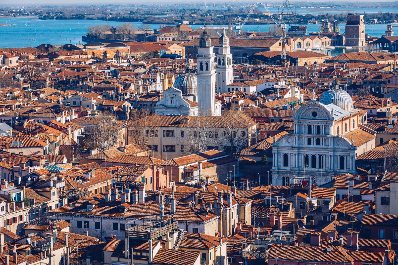 Venice panoramic aerial view with red roofs, Veneto, Italy. Aerial view with dense medieval red roofs of Venice, Italy 