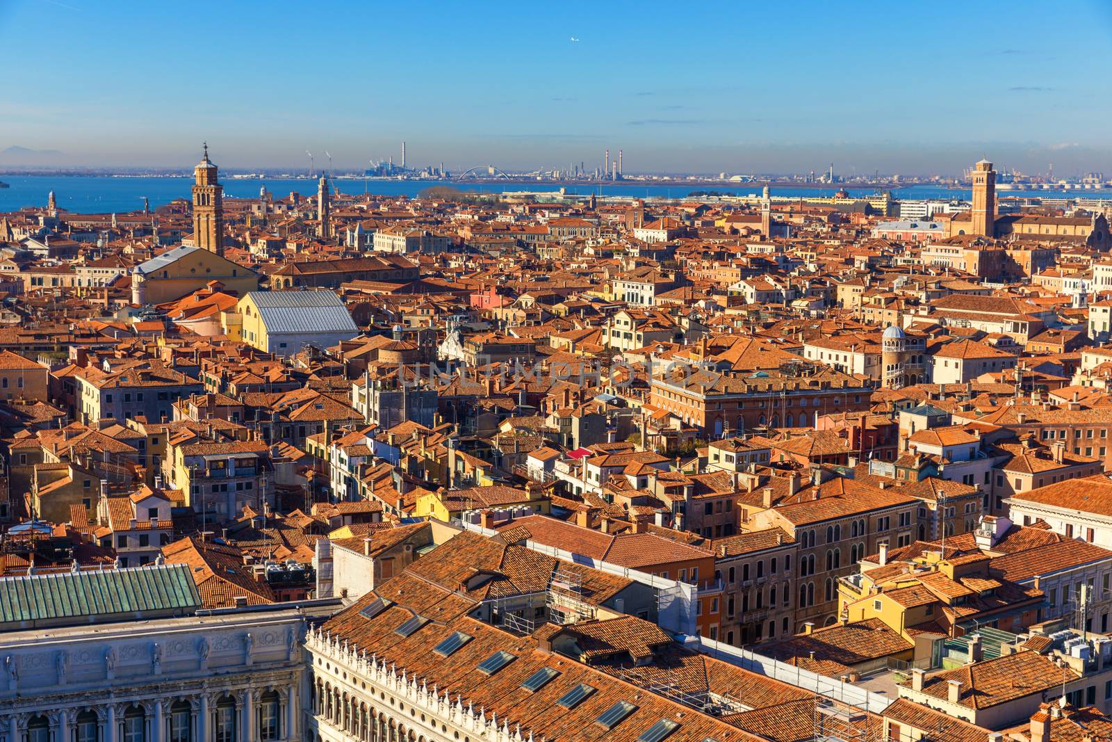 Venice panoramic aerial view with red roofs, Veneto, Italy. Aerial view with dense medieval red roofs of Venice, Italy 