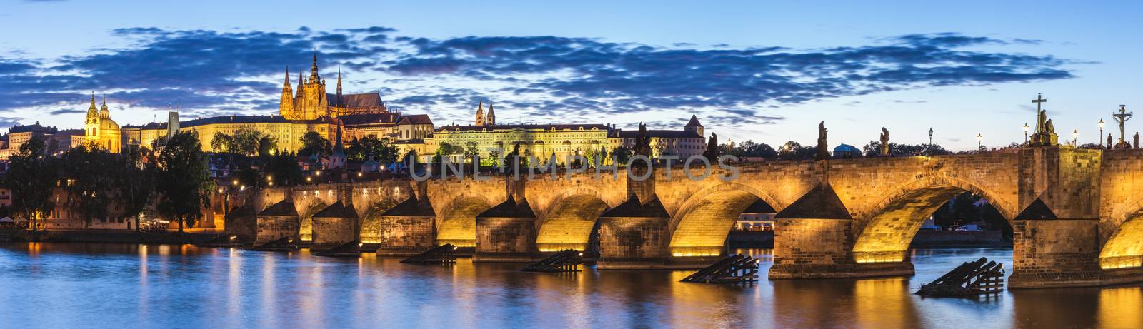 View of Prague Castle and Charles Bridge at sunset. Czechia