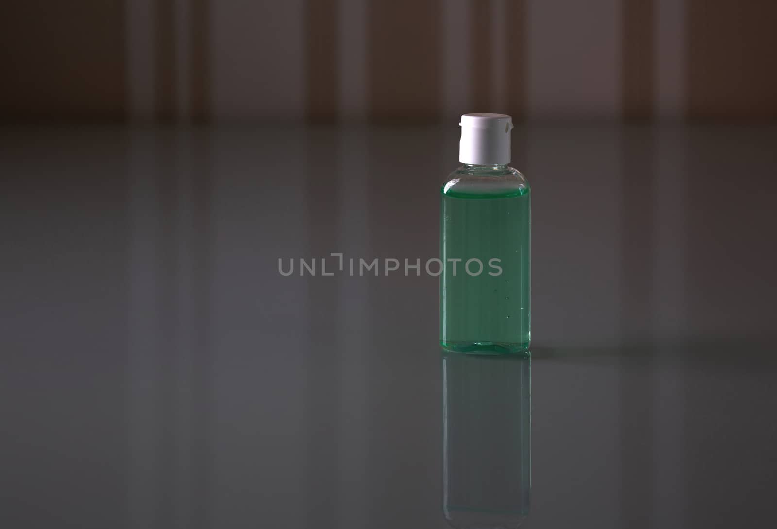 Bottle with green antiseptic gel  by ViktoriiaPav