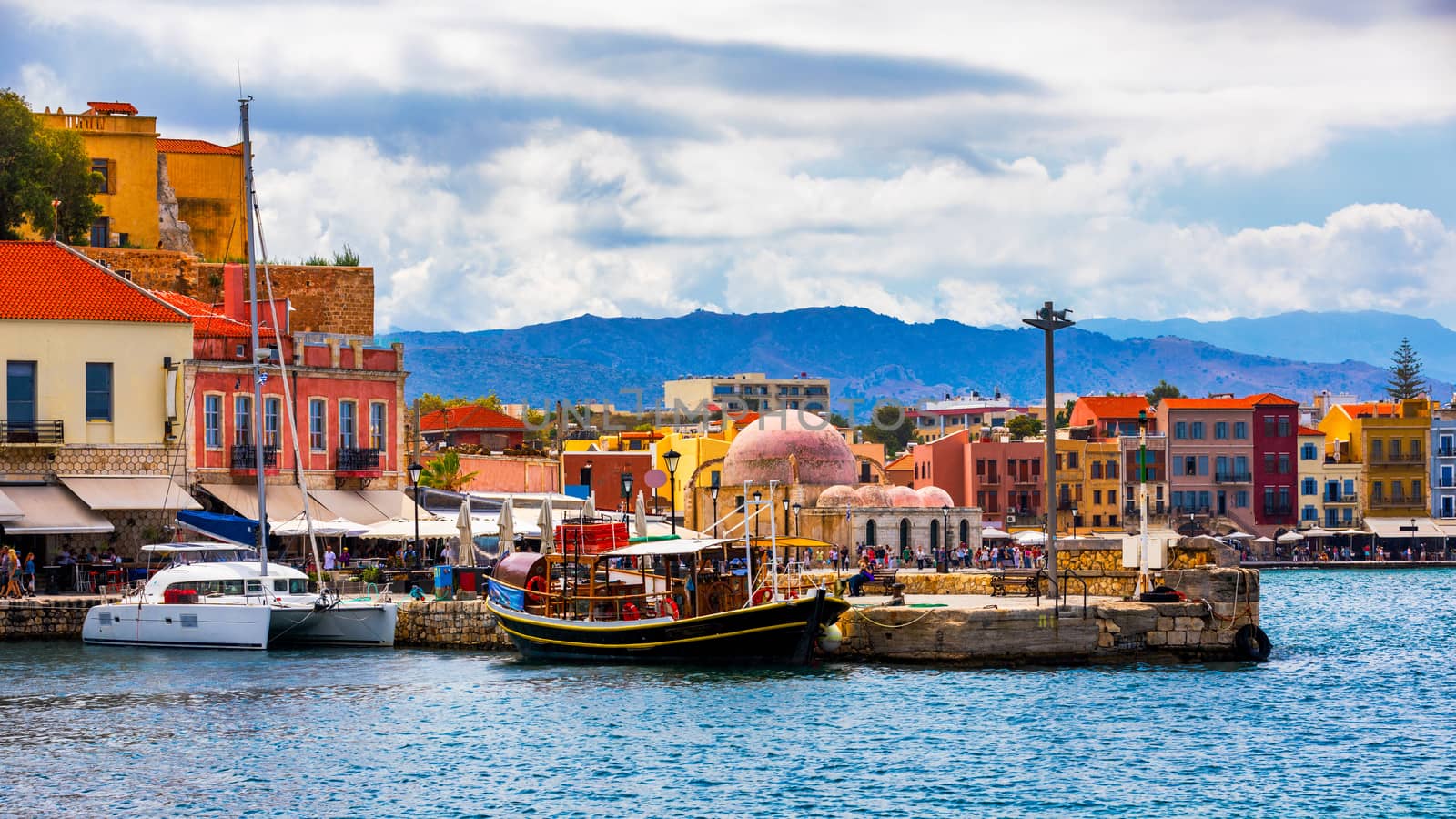 View of old port of Chania. Landmarks of Crete island. Greece. Bay of Chania at sunny summer day, Crete Greece. View of the old port of Chania, Crete, Greece. The port of chania, or Hania. 