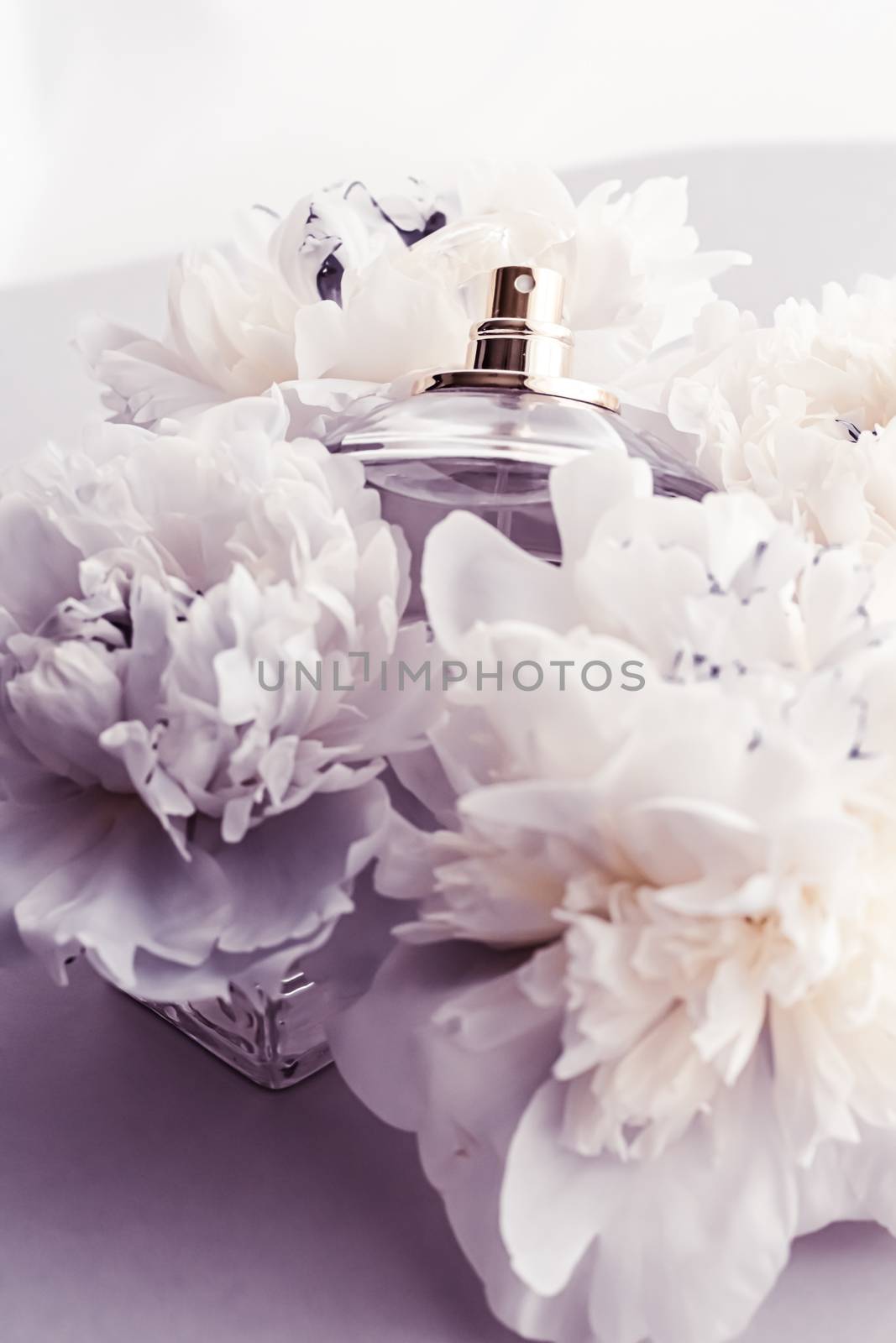 Violet fragrance bottle as luxury perfume product on background of peony flowers, parfum ad and beauty branding by Anneleven