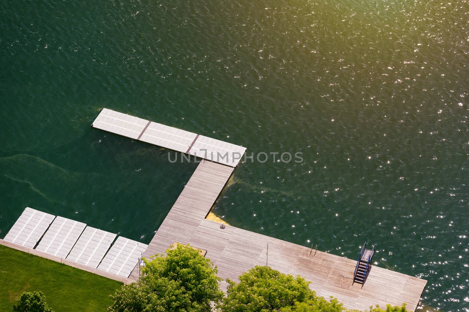 Empty wooden pier close to Bled lake, swimming area of the Bled  by DaLiu