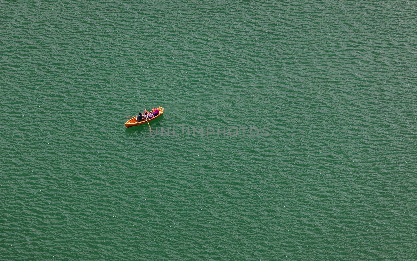 Lake Bled, Slovenia. Top view of a boat sailing in the lake. Bled lake is the most famous lake in Slovenia. Bled, Slovenia.