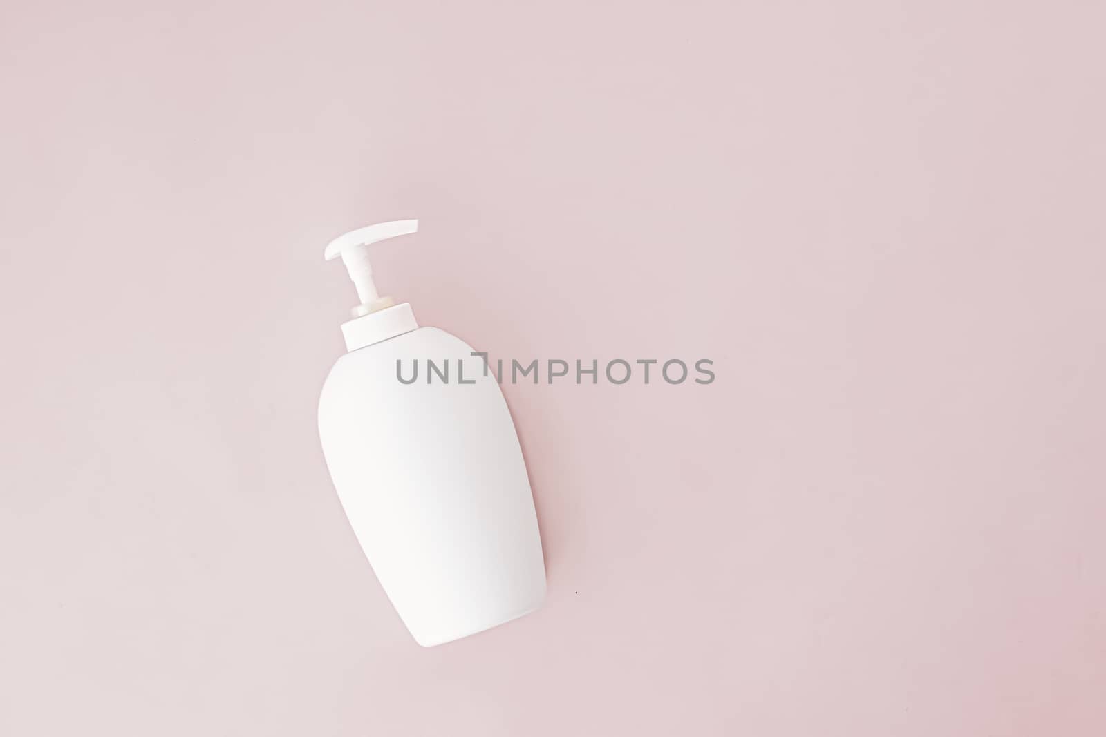 Bottle of antibacterial liquid soap and hand sanitizer on beige background, hygiene product and health care concept