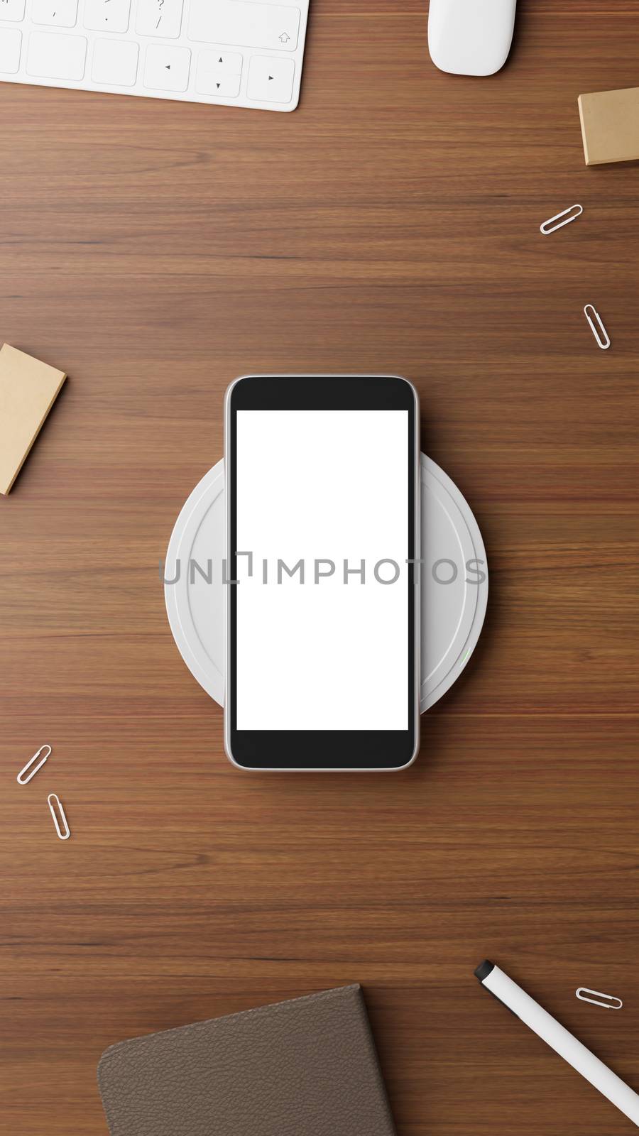 Mobile phone mockup scene. Mobile phone charging battery with wireless charger on working table.