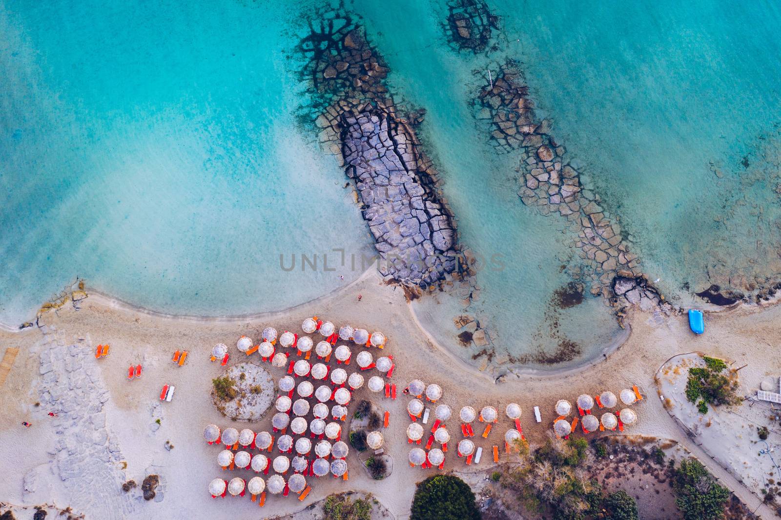 Aerial view of beautiful tropical Elafonissi Beach with pink sand. View of a nice tropical Elafonissi beach from the air. Beautiful sky, sea, resort. Elafonissi beach, Crete, Greece.