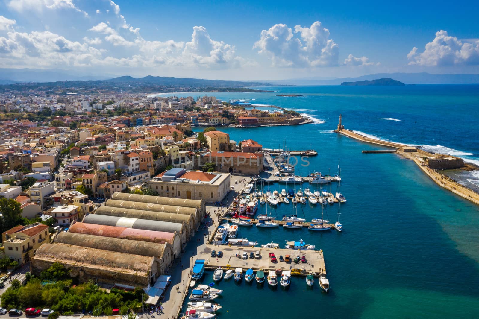 Picturesque old port of Chania. Landmarks of Crete island. Greece. Aerial view of the beautiful city of Chania with it's old harbor and the famous lighthouse, Crete, Greece.