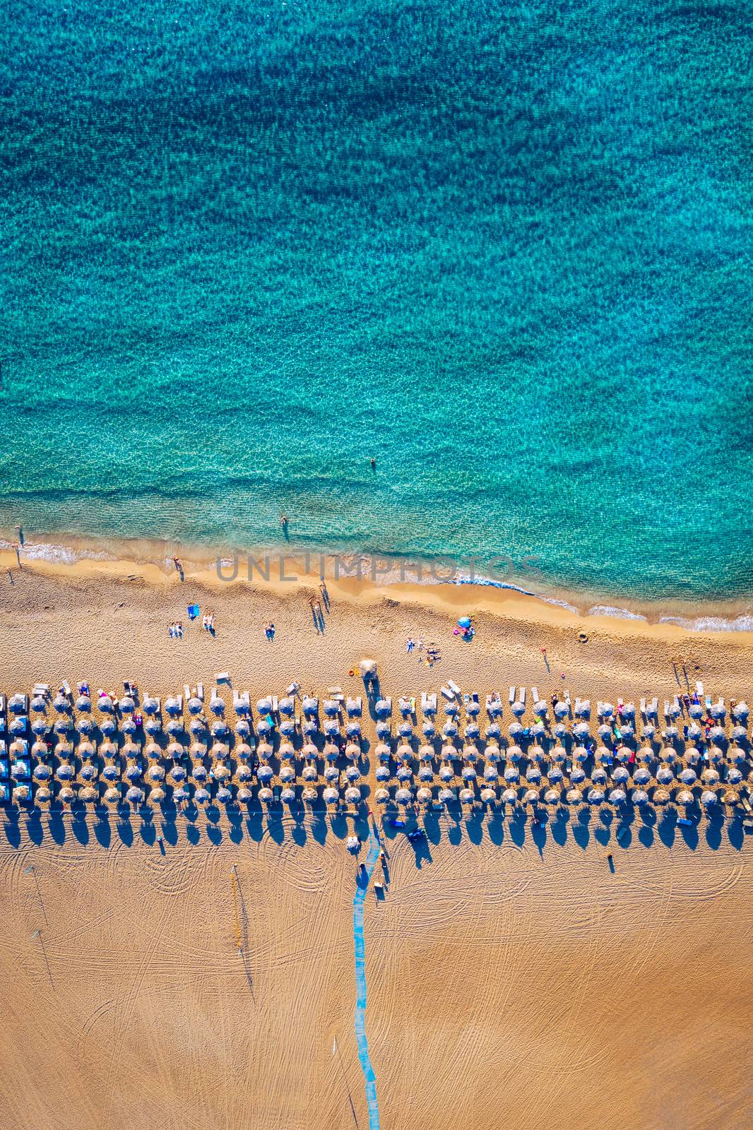 Aerial shot of beautiful turquoise beach Falasarna (Falassarna) in Crete, Greece. View of famous paradise sandy deep turquoise beach of Falasarna (Falassarna) in North West, Crete island, Greece.