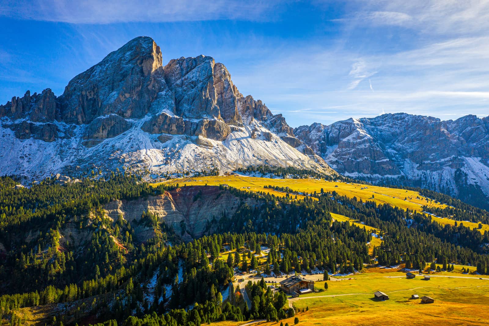 Stunning view of Peitlerkofel mountain from Passo delle Erbe in Dolomites, Italy. View of Sass de Putia (Peitlerkofel) at Passo delle Erbe, with wooden farm houses, Dolomites, South Tyrol, Italy.