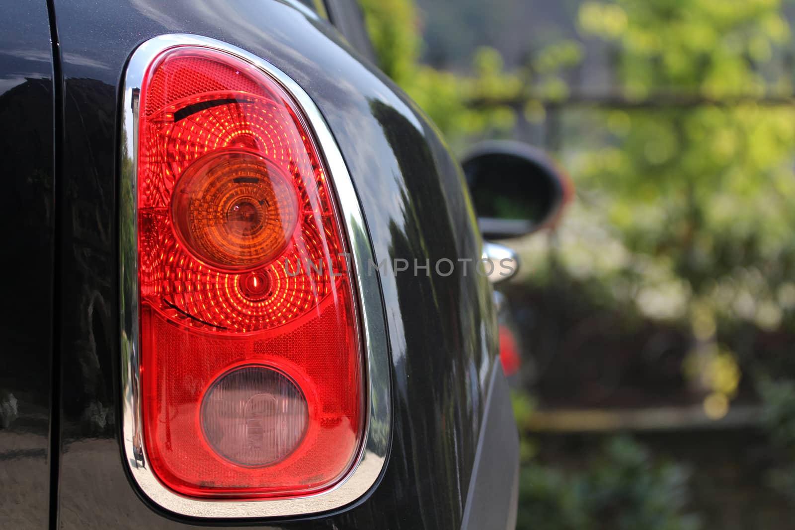 the tail lights on a luxury passenger car