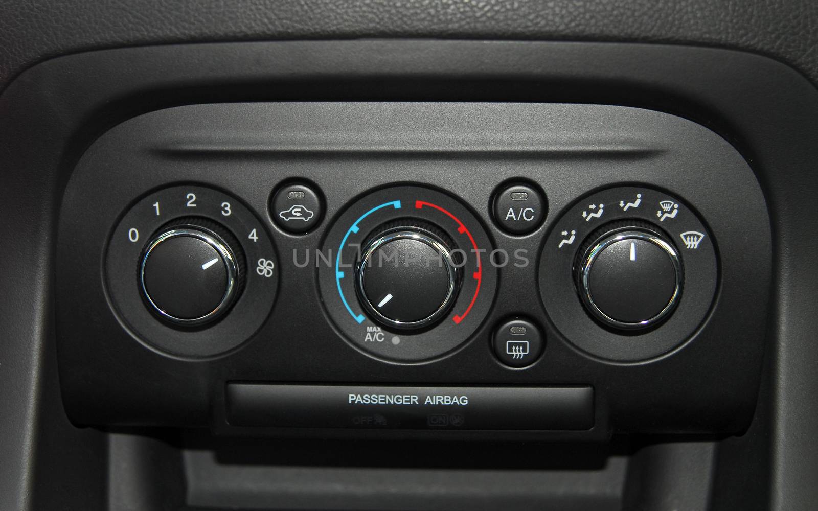 manual switches the air conditioning on the dashboard of the car