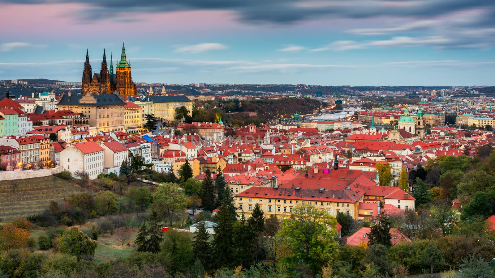 Prague autumn landscape. Prague autumn landscape view to Saint Vitus cathedral. Prague. Prague panorama. Prague, Czech Republic. Scenic autumn aerial view of the Old Town with red foliage. Czechia.