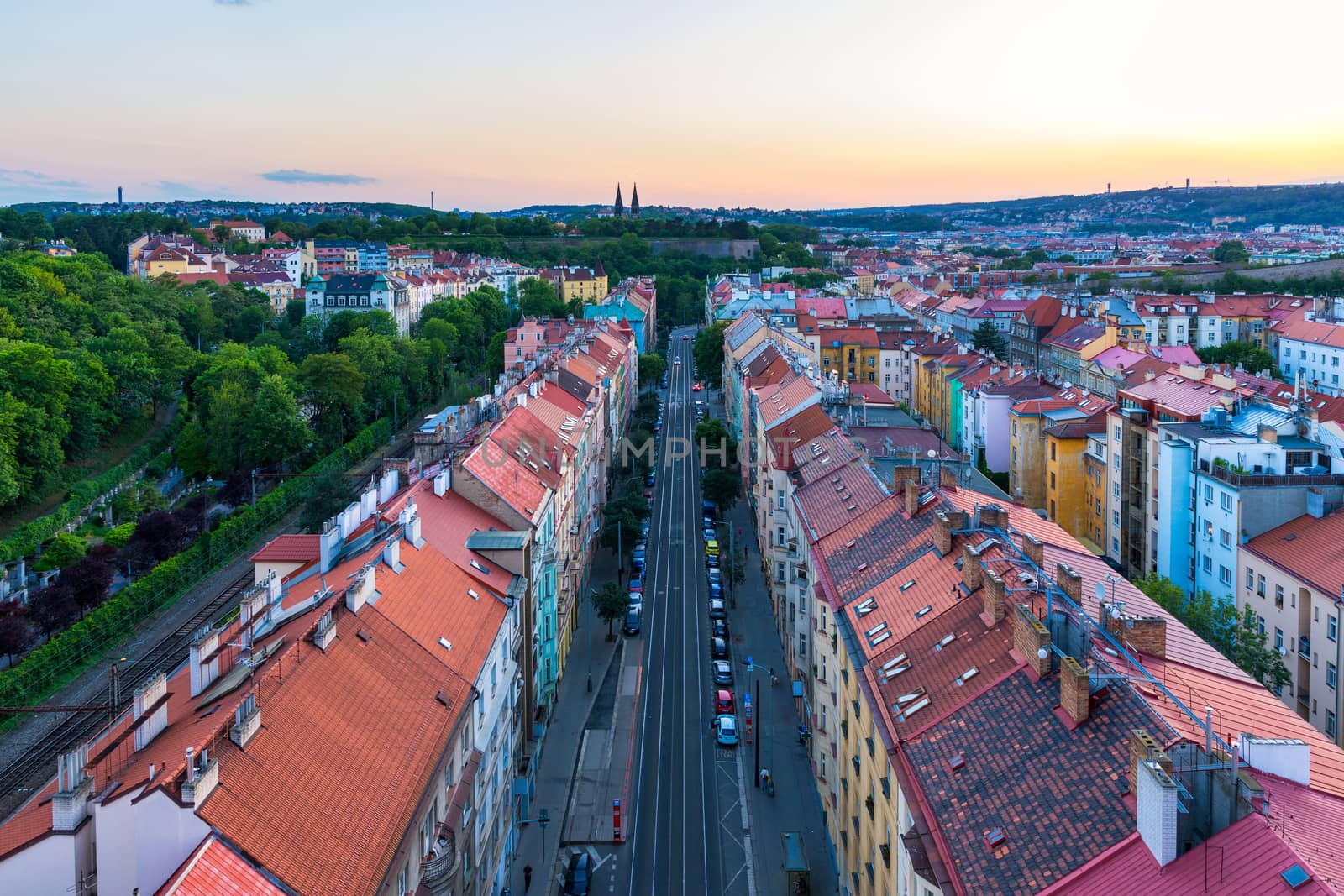 View of Prague taken from Nuselsky bridge (Nusle Bridge). Famous Vysehrad fort is behind it with Basilica of St. Peter and St. Paul. The Nusle Distric cityscape as seen from Vysehrad. Prague, Czechia.