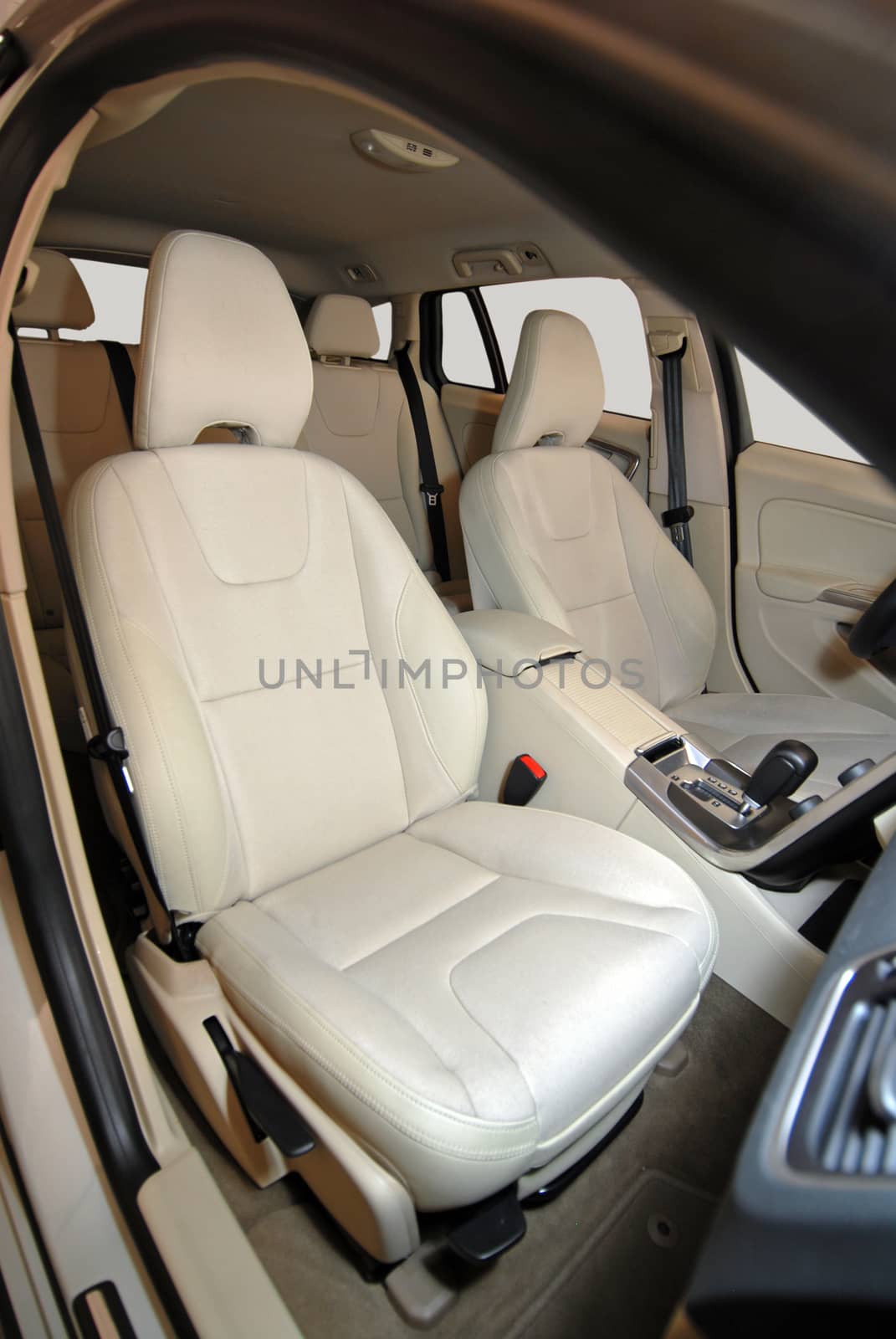 front seats in a car made of white-coated leather
