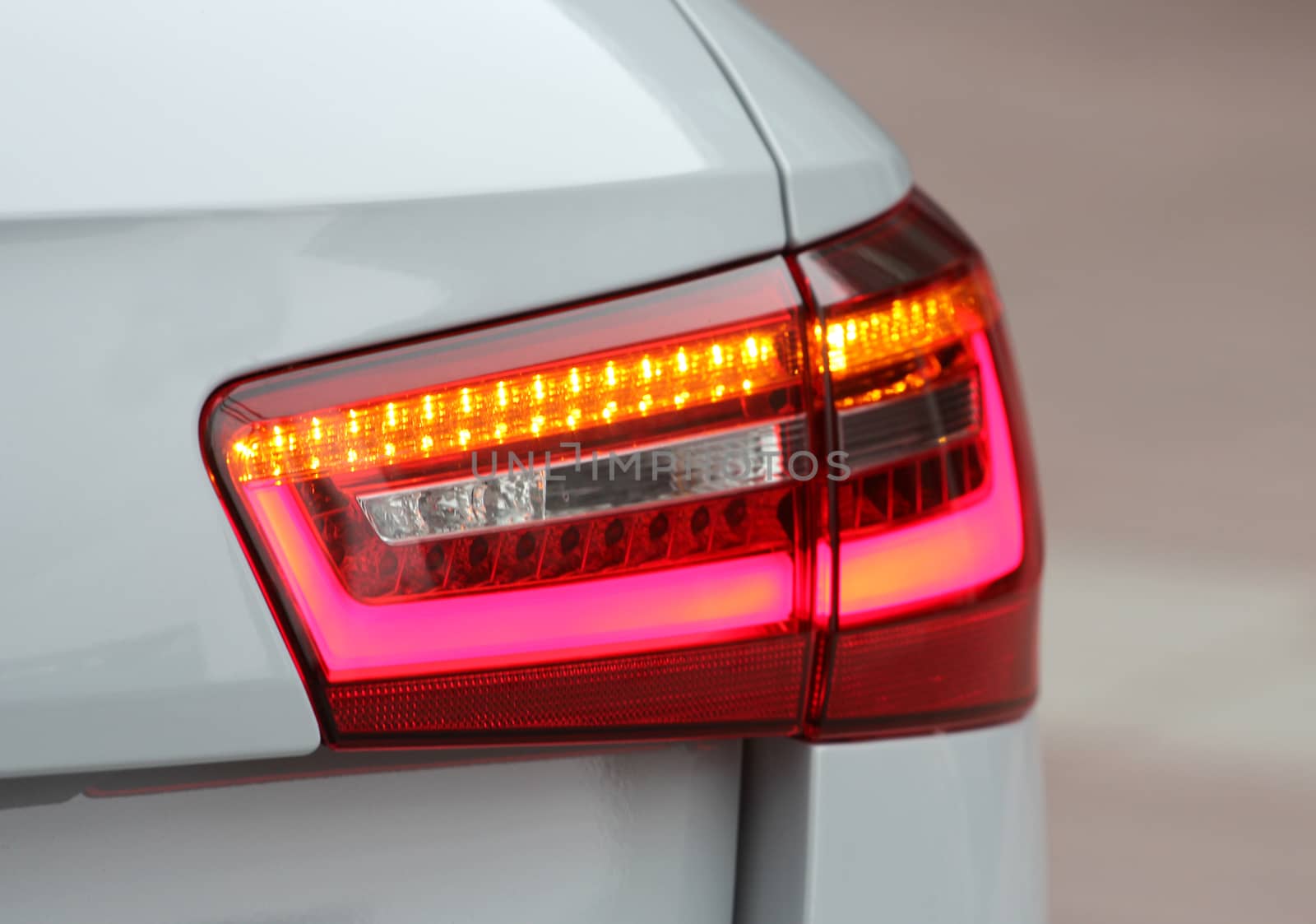 the tail lights on a luxury passenger car