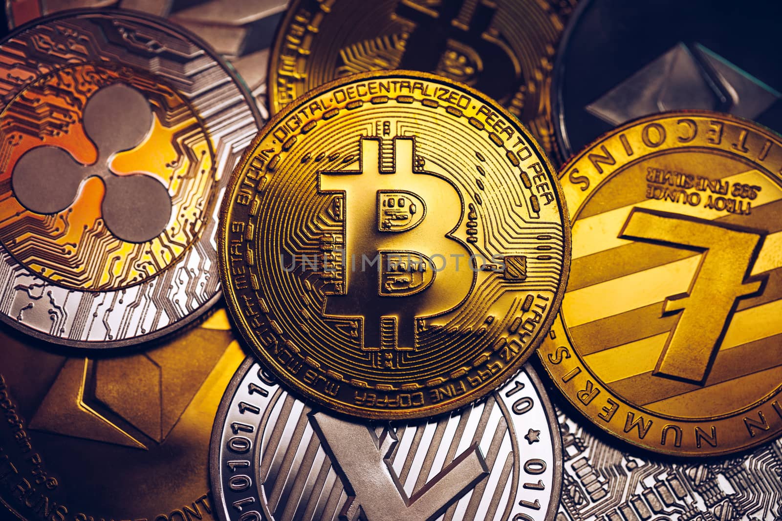 Set of cryptocurrencies with Bitcoin, Etherium, Ripple, Litecoin. Cryptocurrencys new digital money. Bitcoin on the front as the leader. Bitcoin as most important cryptocurrency.
